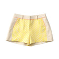 Skirt with yellow patterned front and beige back on a white background