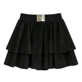 Black tiered skirt with a visible brand label on a light gray background
