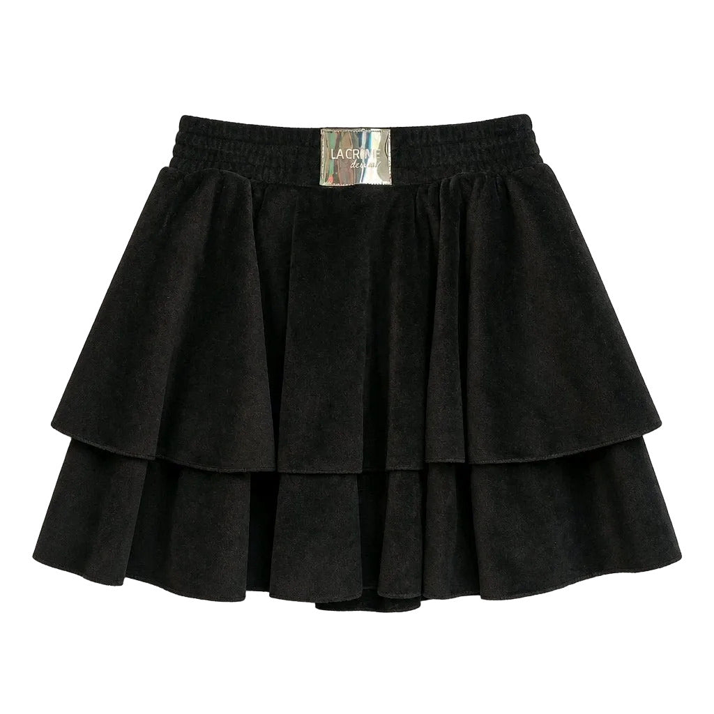Black tiered skirt with a visible brand label on a light gray background
