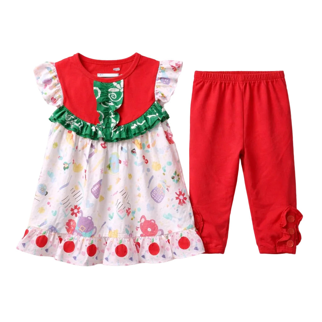 Children's outfit with a dress and red pants on a white background