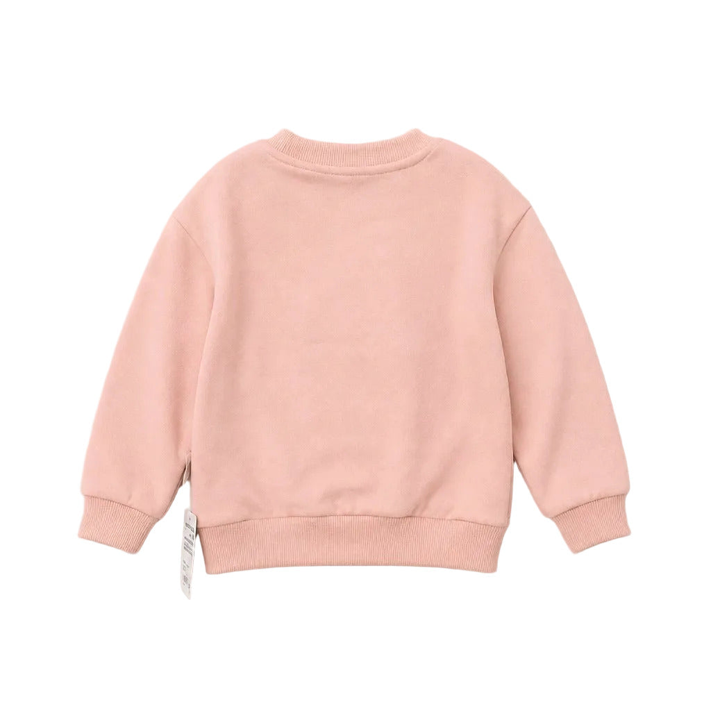A light pink crewneck sweatshirt shown from the back, laid flat against a neutral off-white background.
