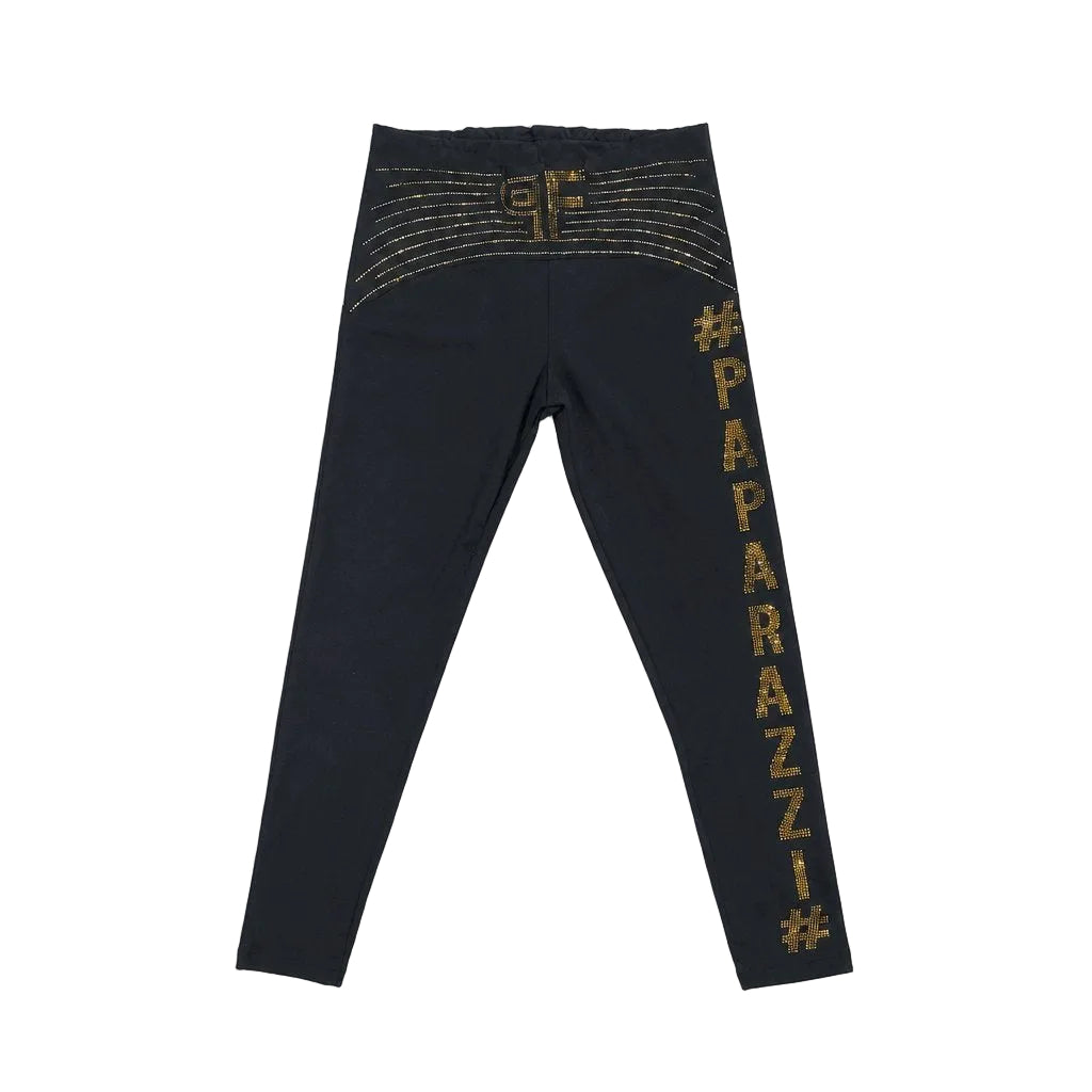 Black leggings with gold text on a light gray background