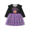 Halloween-themed dress with black top and purple tulle skirt on a light gray background