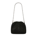 Black beaded handbag with a chain strap on a light gray background