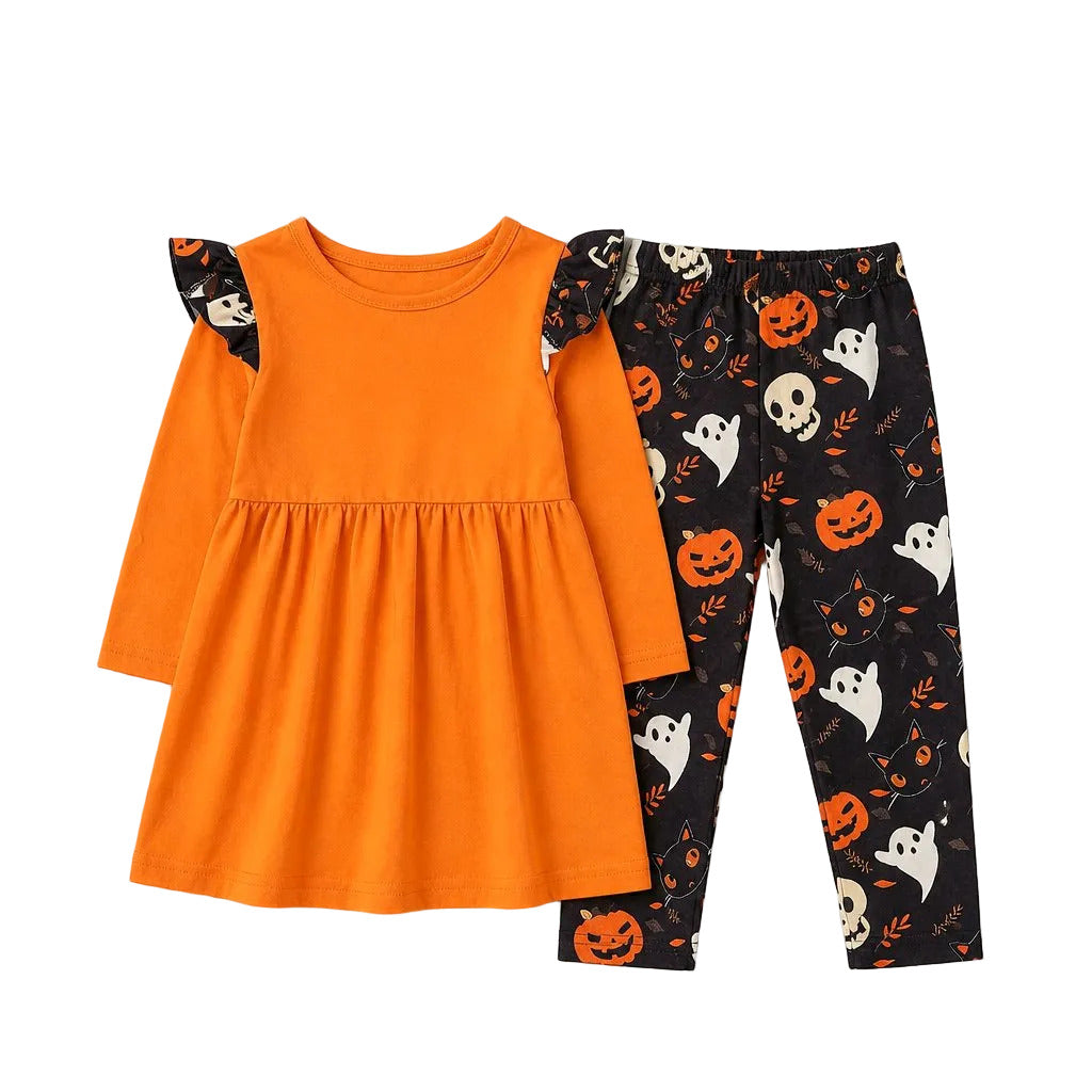 Halloween-themed children's outfit with orange dress and black pants with ghost and pumpkin pattern on a gray background.