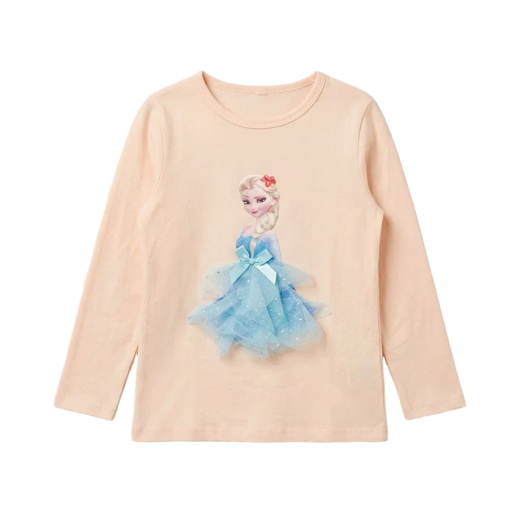 A children's long-sleeve t-shirt in a pale peach color, featuring a graphic of the Disney character Elsa in a light blue tulle dress with a blue bow on the front.