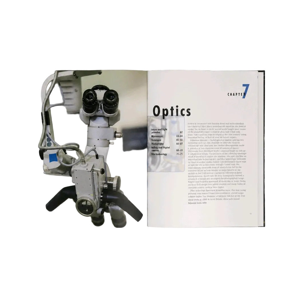 An open book or magazine spread on a light gray background. The left page has black text and a small inset photo, and the right page shows a close-up photograph of an optical microscope with the word 'Optics' at the bottom.