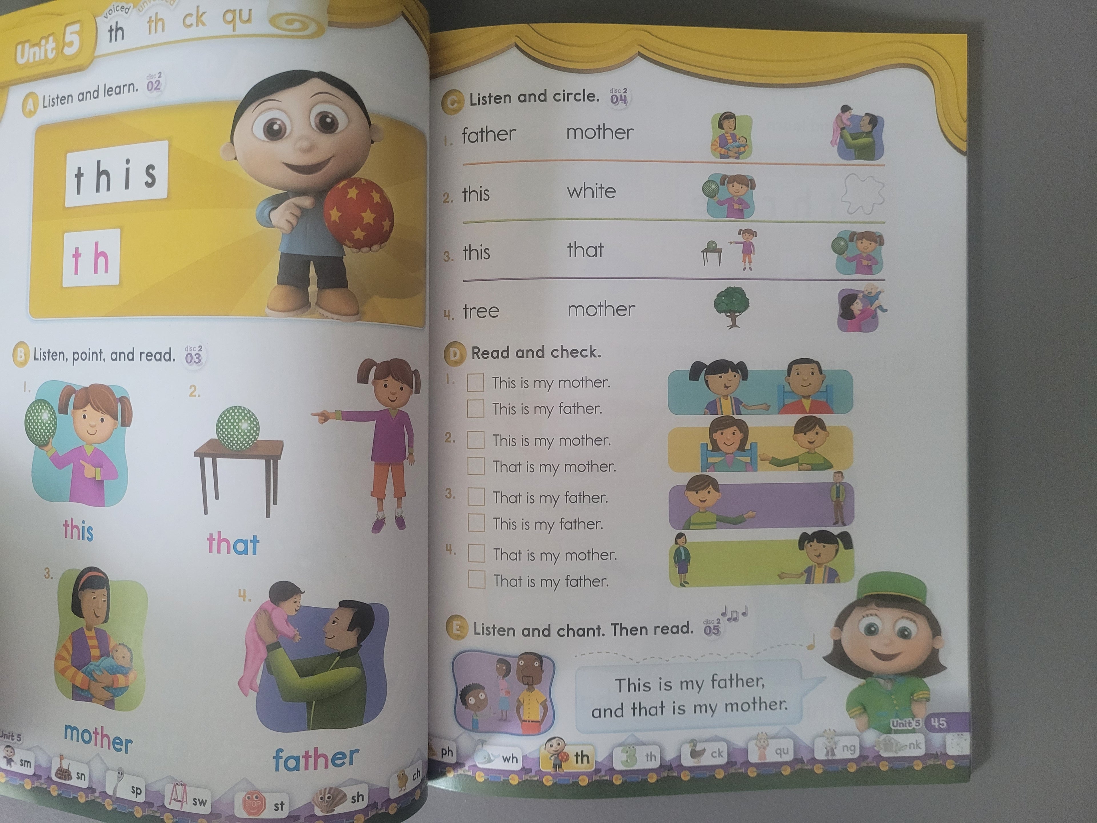 Open book with educational content on a gray background