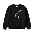 Black sweatshirt with white cat design and pink flowers on a light gray background