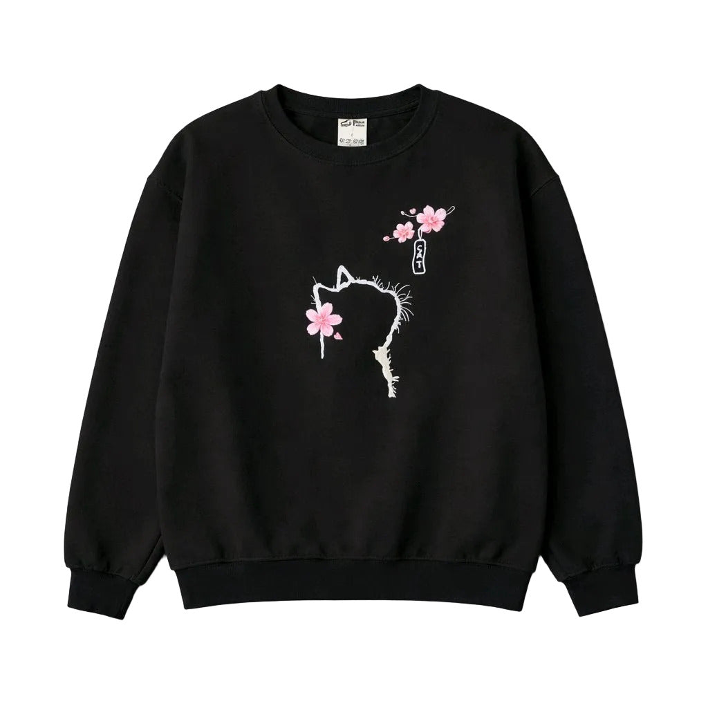 Black sweatshirt with white cat design and pink flowers on a light gray background
