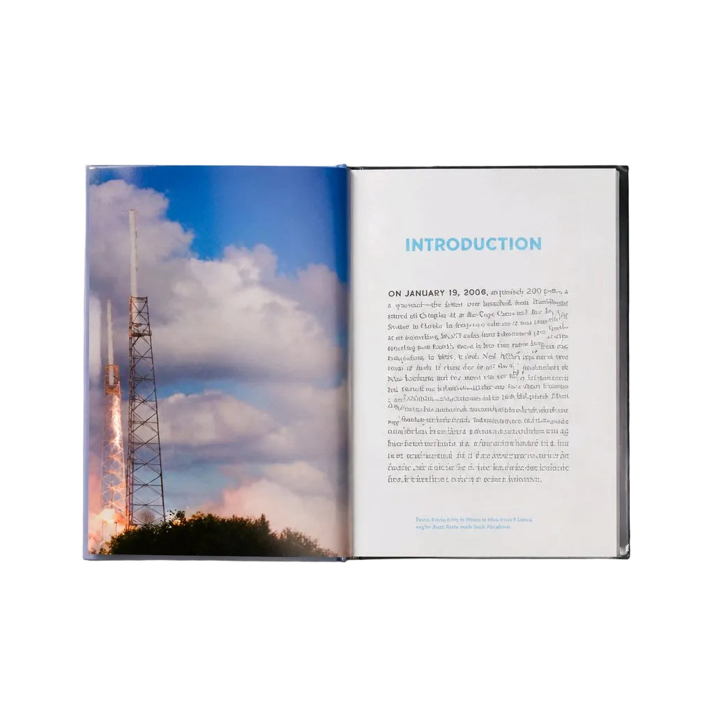An open book or booklet laid flat on a light gray background, showing a printed cover with a large space-launch photograph on the left page and an introduction text page on the right page.