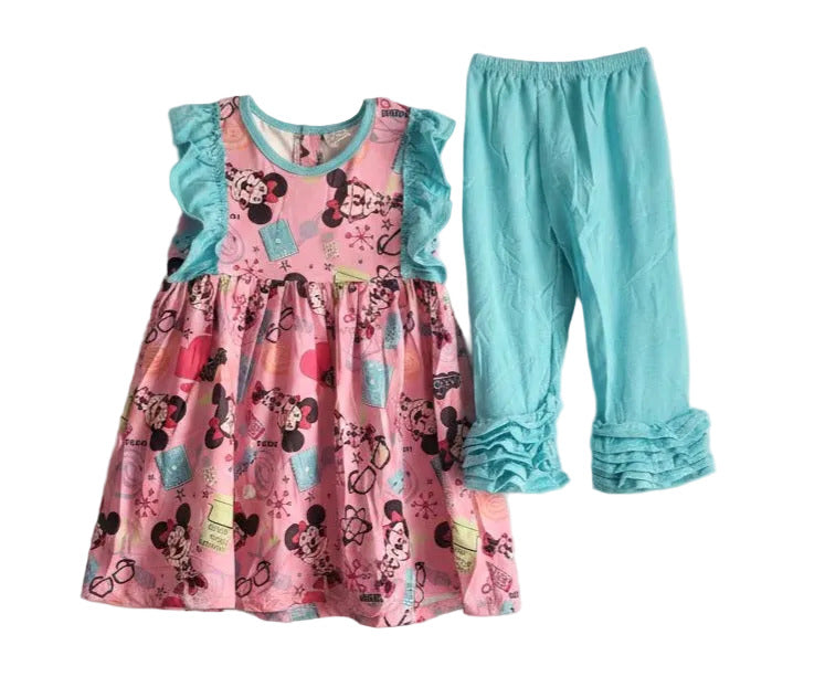 Pink dress with Minnie Mouse design and blue pants on a light gray background