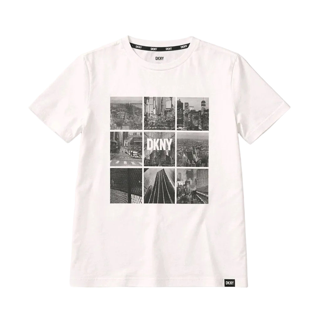 White t-shirt with black and white cityscape design and DKNY logo on a white background