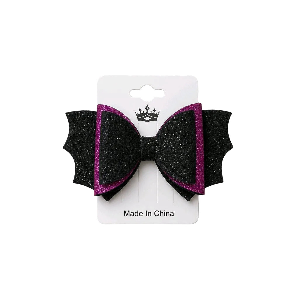 Black and pink glitter bow on a white card with a brand logo, on a light gray background.