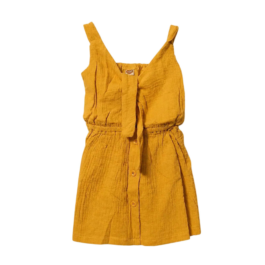 Yellow dress with button details on a light gray background