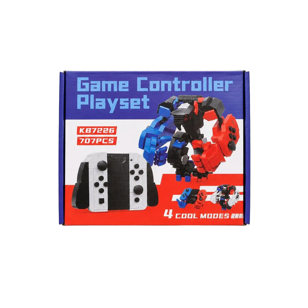 A boxed toy playset labeled 'Game Controller Playset' on a light gray background. The package shows a white and black game controller, a red and blue robot figure, and text including 'K87236', '707PCS', and '4 COOL MODES'.