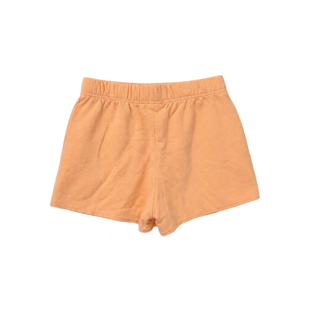 Orange shorts on a light gray background