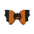 Halloween-themed bow with black bat wings and orange center on a light gray background