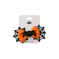 Orange bow with spider and web design on a white card, 'Made in China' text visible