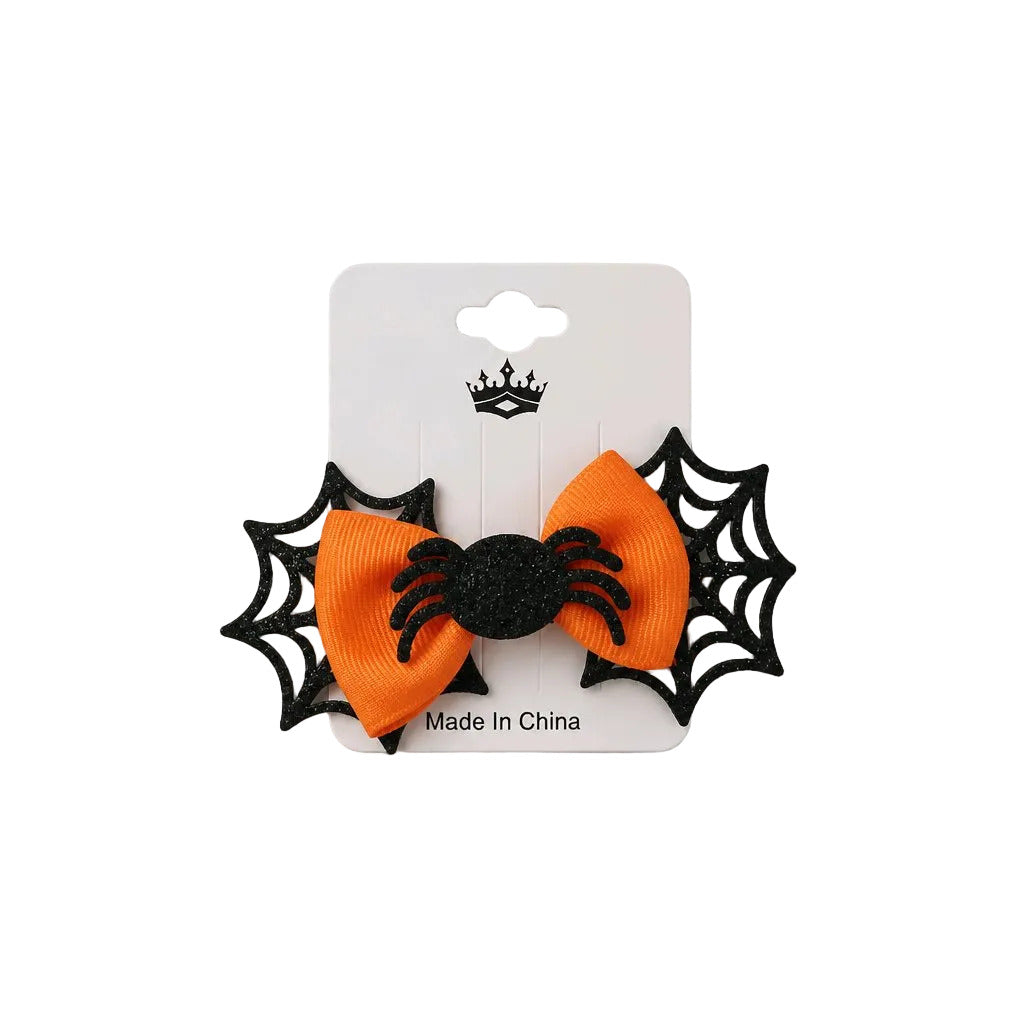 Orange bow with spider and web design on a white card, 'Made in China' text visible