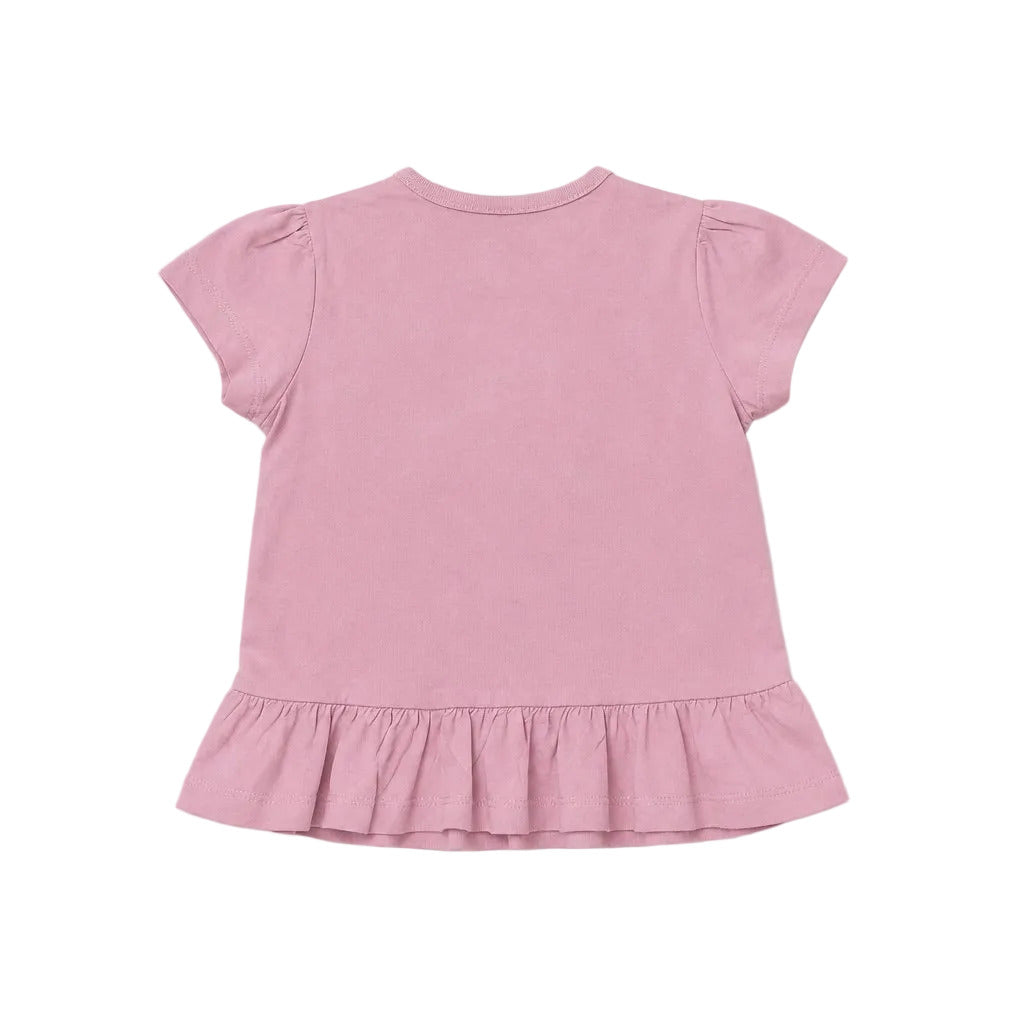 Pink dress with ruffled hem on a light gray background