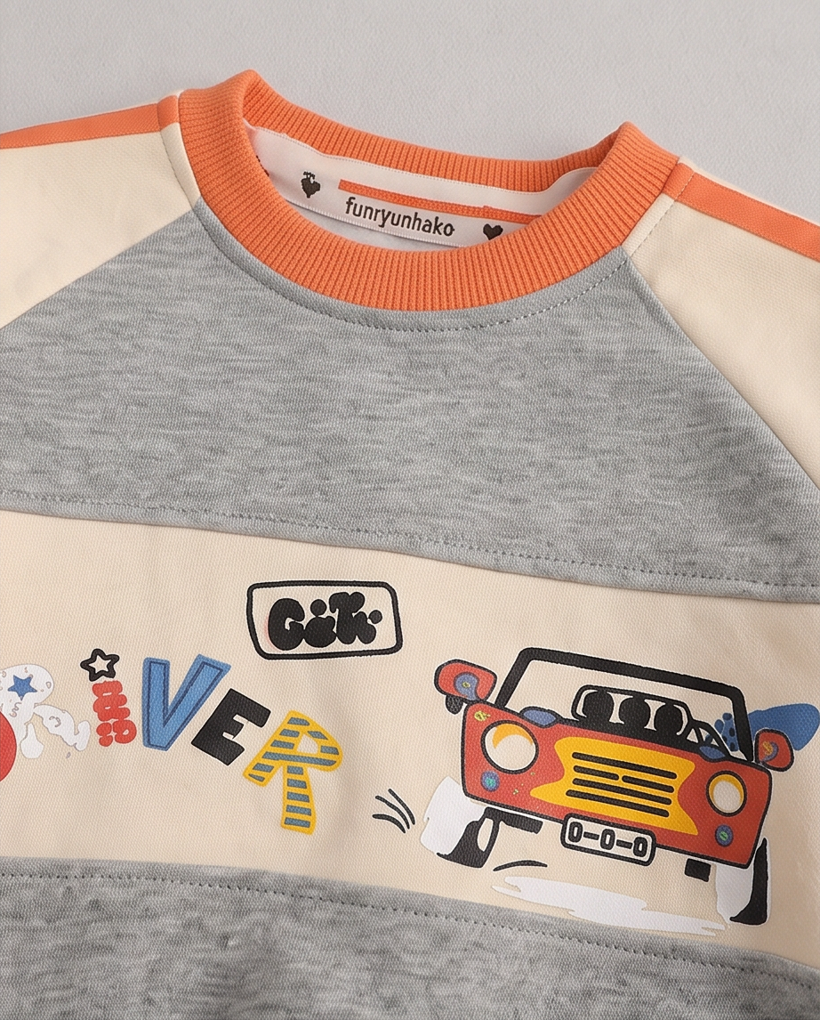 A close-up of a children's long-sleeve raglan sweatshirt by Funyunhako. The garment features a heather gray body and sleeves, with a cream-colored chest panel and shoulder yoke.