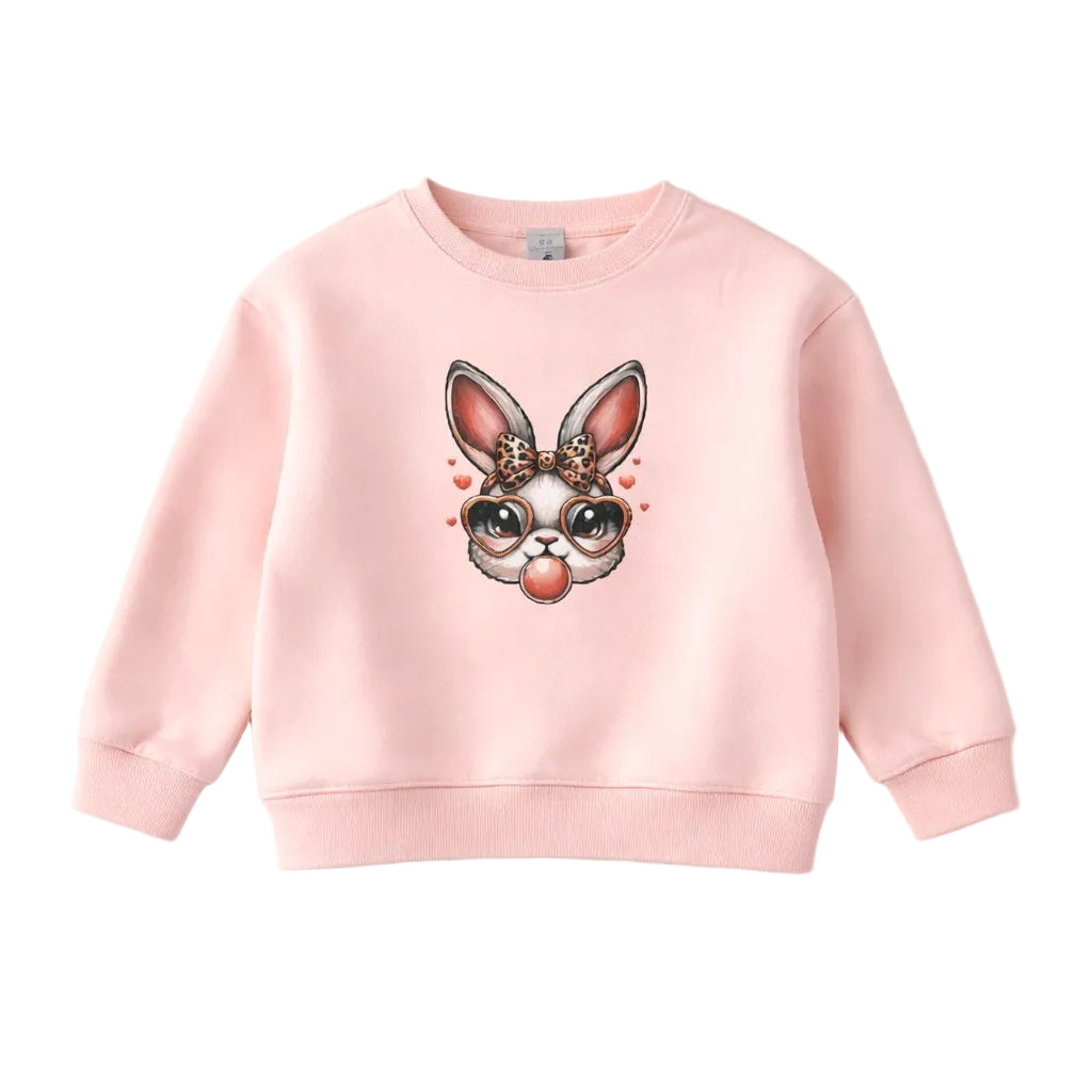 Pink sweatshirt with a cartoon bunny design on a white background