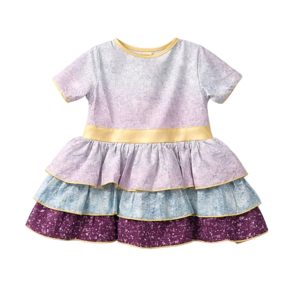 Children's dress with multicolored ruffled layers on a white background