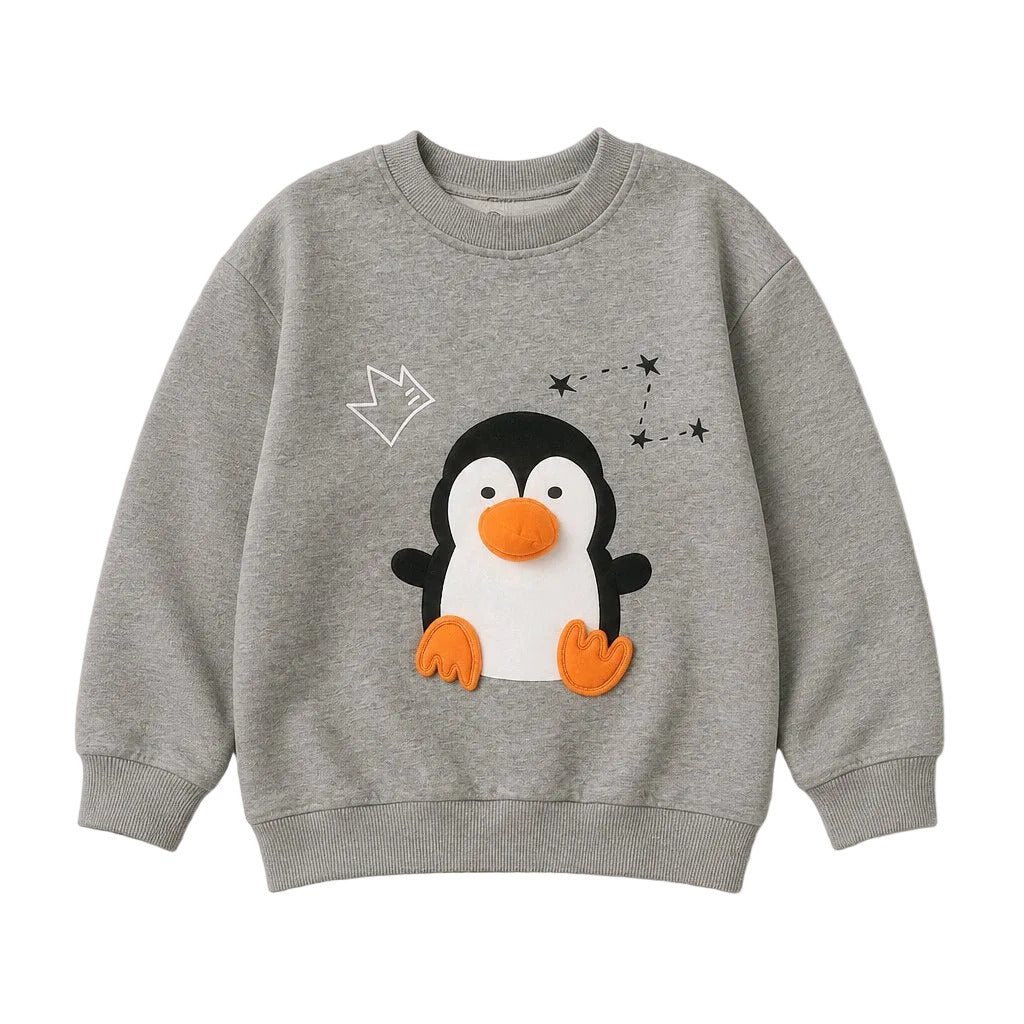 A heather gray crewneck sweatshirt featuring a 3D penguin applique with an orange beak and feet, a white outline of a crown, and black star details on the front.