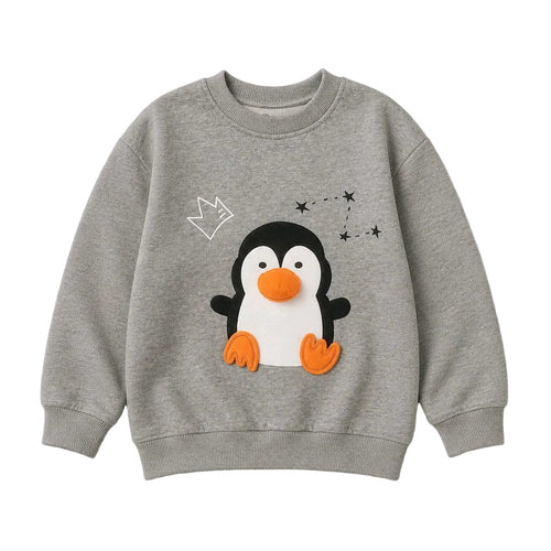 A heather gray crewneck sweatshirt featuring a 3D penguin applique with an orange beak and feet, a white outline of a crown, and black star details on the front.