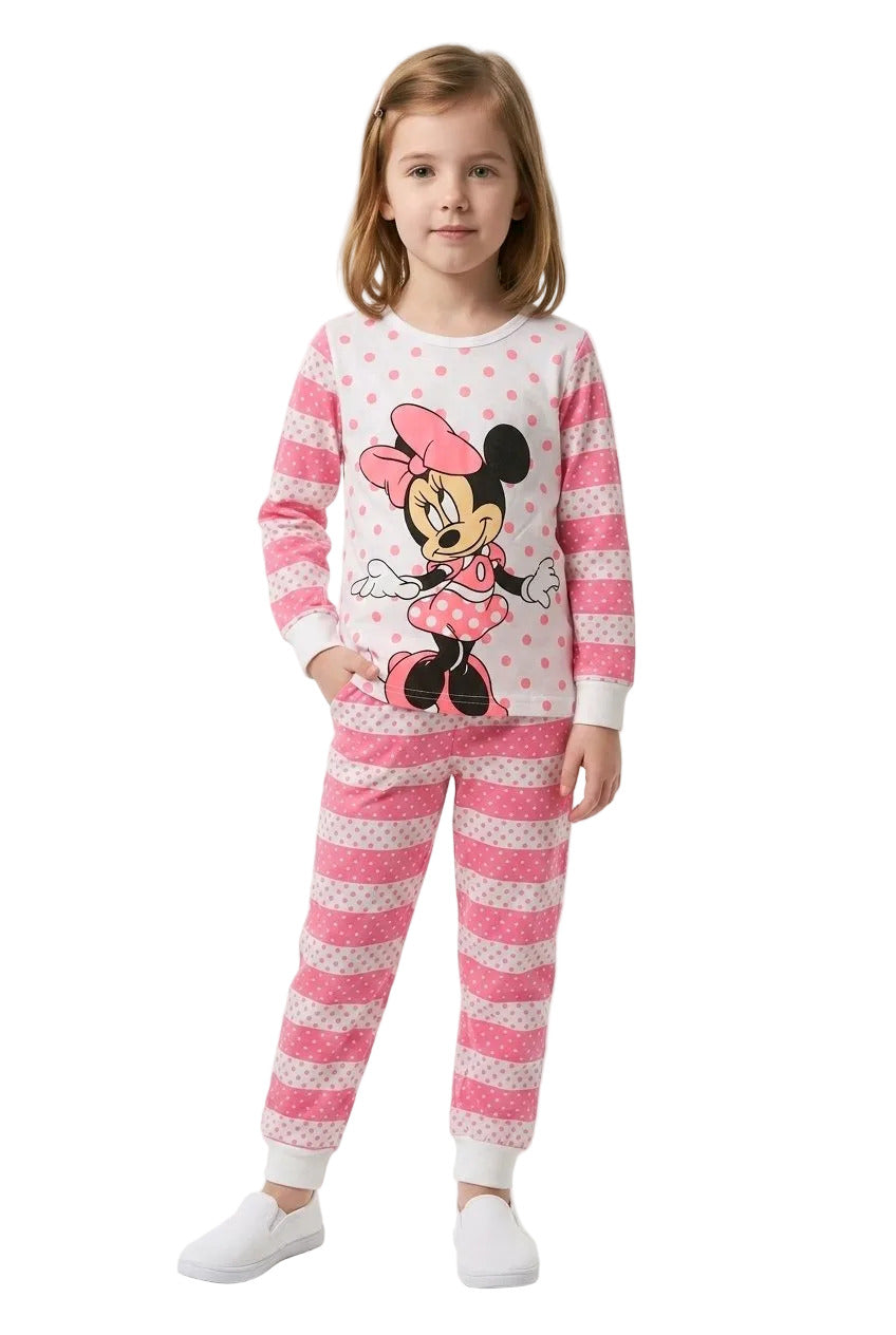 Child wearing a pink Minnie Mouse pajama set on a white background