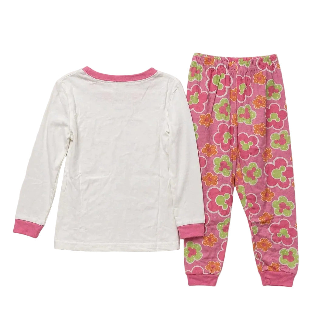 Children's pajama set with white top and pink floral pants on a light gray background