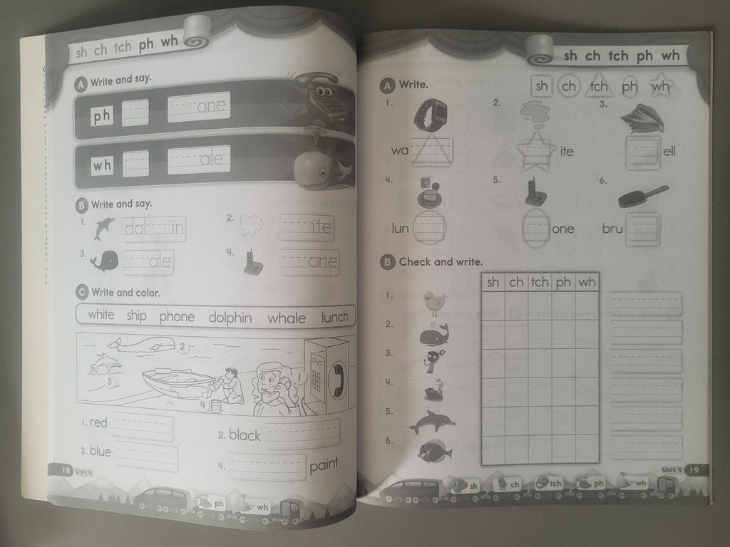 Open book with educational content on phonics and vocabulary, featuring text and illustrations.