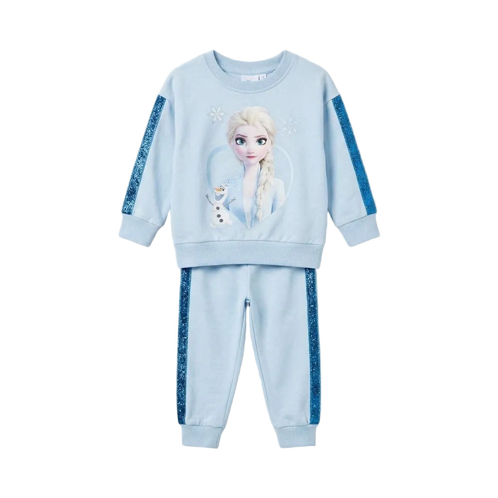 A children's two-piece matching sweatshirt and jogger pants set in light blue, featuring a Frozen graphic of Elsa and Olaf on the sweatshirt, and blue glittery side stripes on both the sweatshirt sleeves and pants.