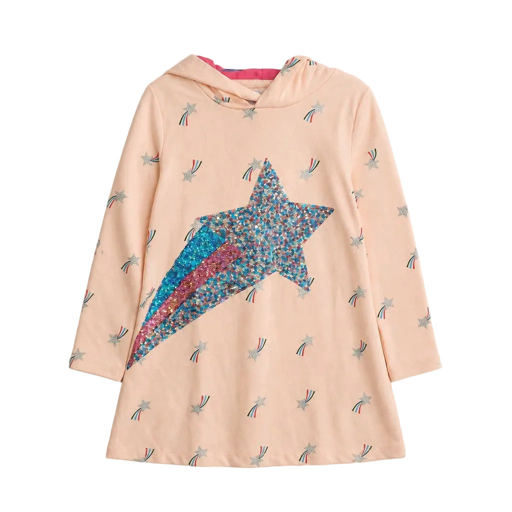 A light peach hooded long-sleeve dress with a large glittery blue and pink star on the front, decorated with small scattered star prints, shown on a neutral gray background.