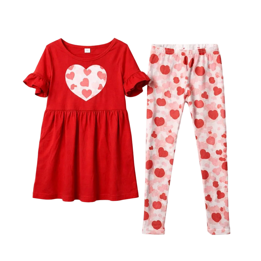 Red dress with heart pattern and pink pants with heart pattern on a white background