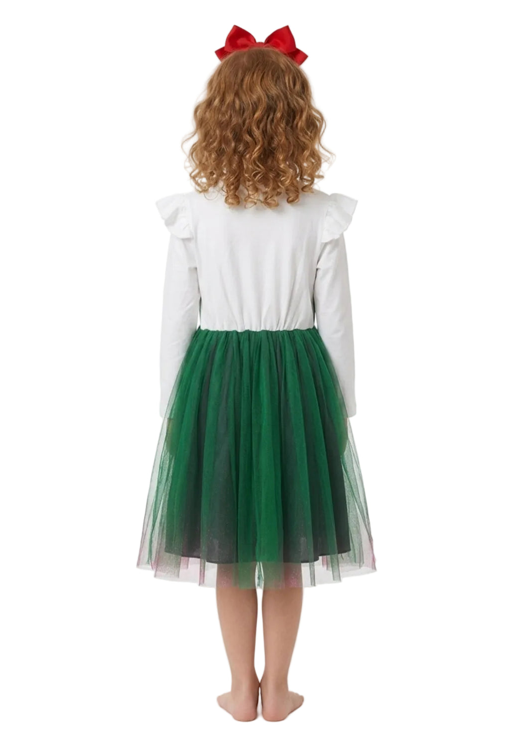Child wearing a white shirt with ruffled sleeves and a green tulle skirt, standing against a white background.