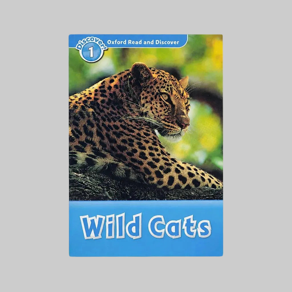 A children's book titled 'Wild Cats' from the 'Oxford Read and Discover' series, featuring a leopard on the cover, displayed on a neutral gray background.