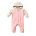 Pink baby onesie with beige hood and cuffs on a white background