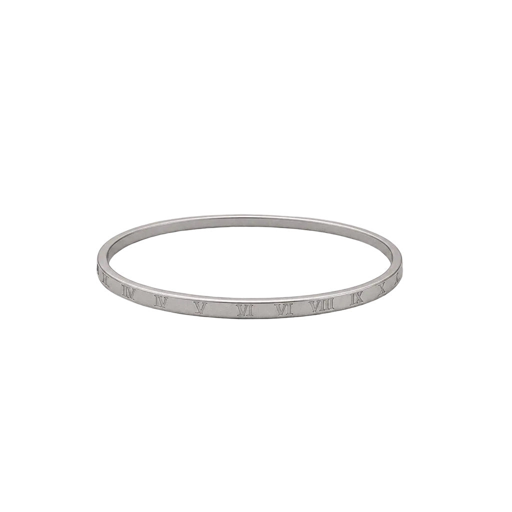 Silver bracelet with engraved Roman numerals on a light gray background