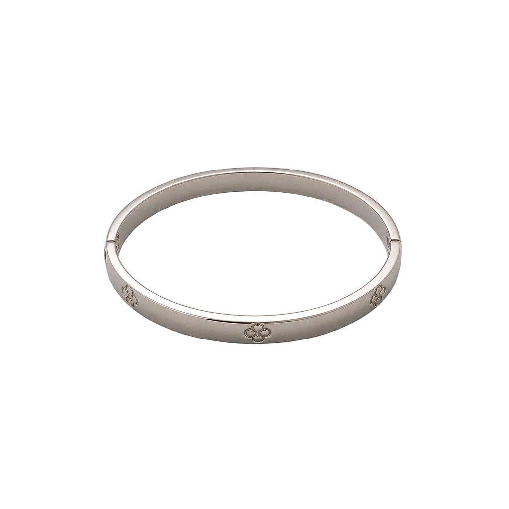 Silver bracelet on a light gray background