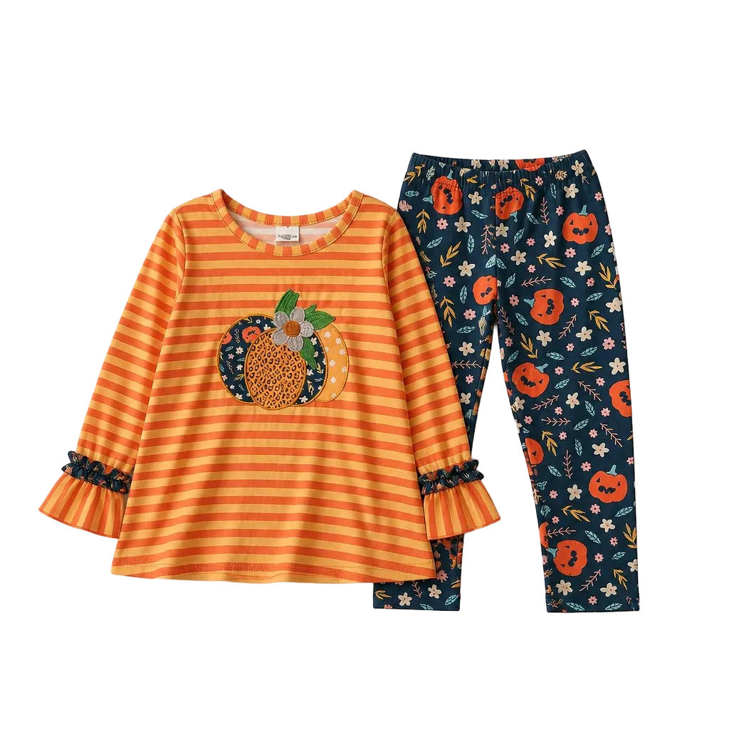 Children's outfit with orange striped shirt and floral-patterned pants on a light gray background