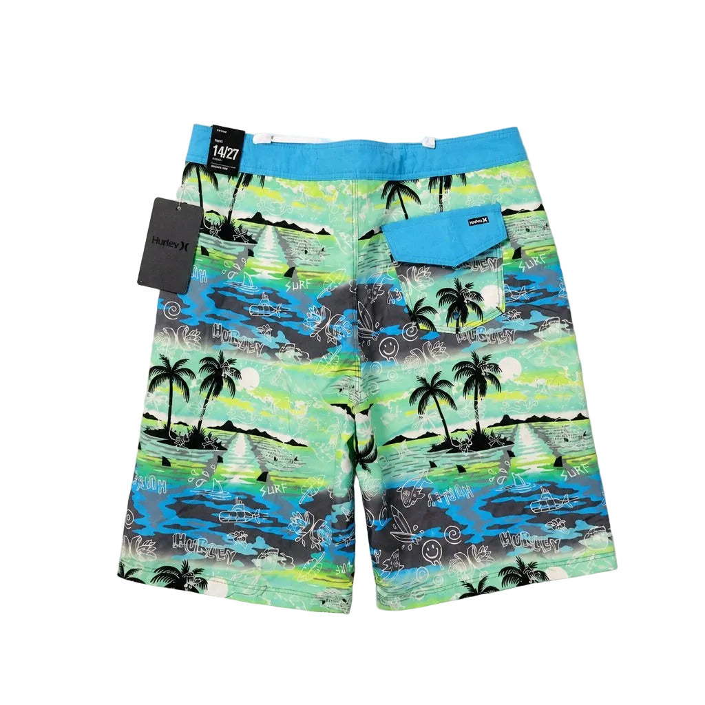 Colorful beach shorts with tropical pattern on a gray background