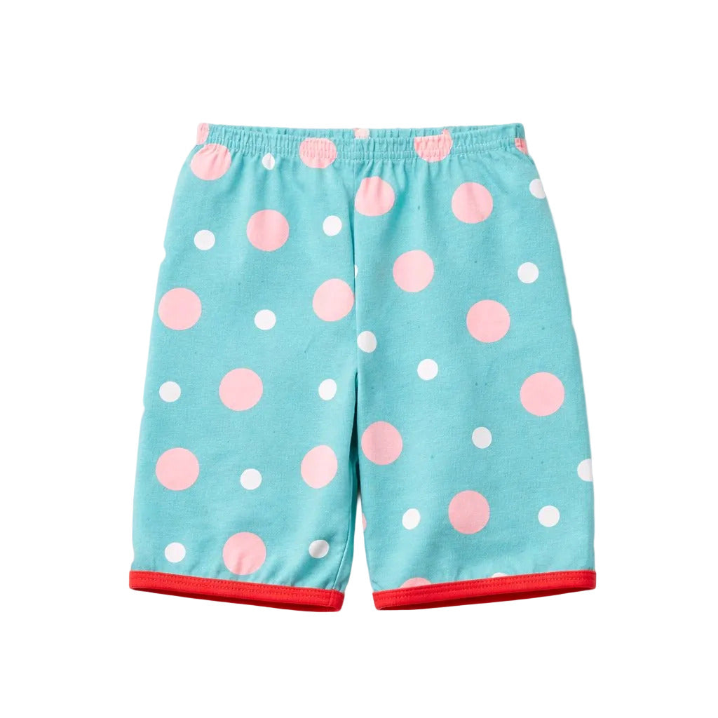 Light blue shorts with pink and white polka dots on a light gray background