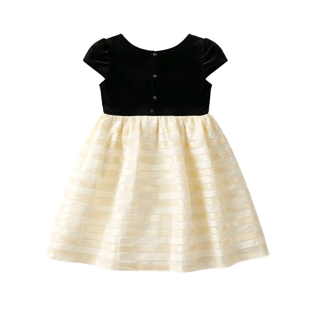 Black top and cream skirt dress on a white background