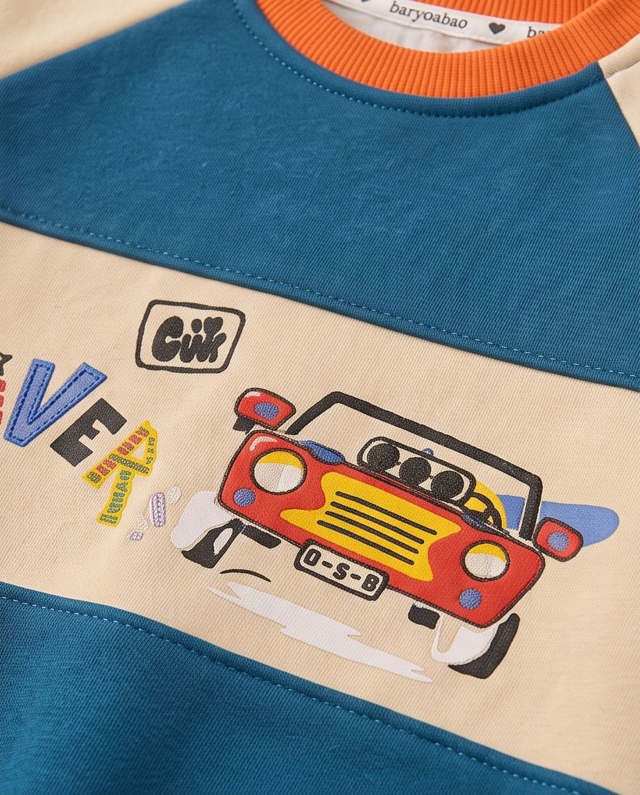 A close-up of a children's raglan sweatshirt featuring a color-blocked design with a teal blue upper section, a beige lower section, and an orange ribbed collar. The front has a graphic print of a red and yellow convertible car and the brand name 'barybao'.