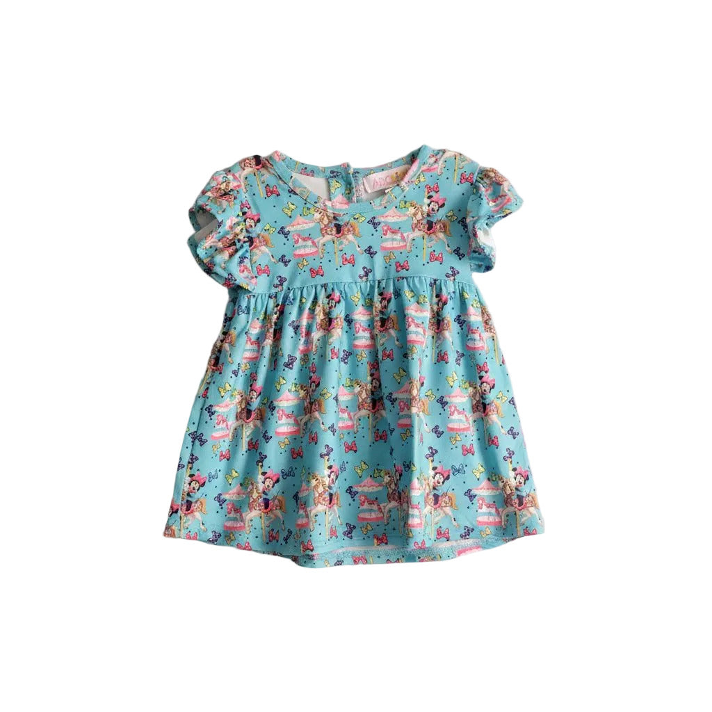 Children's dress with colorful print on a light gray background
