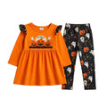 Halloween-themed children's outfit with orange dress and black pants on a gray background