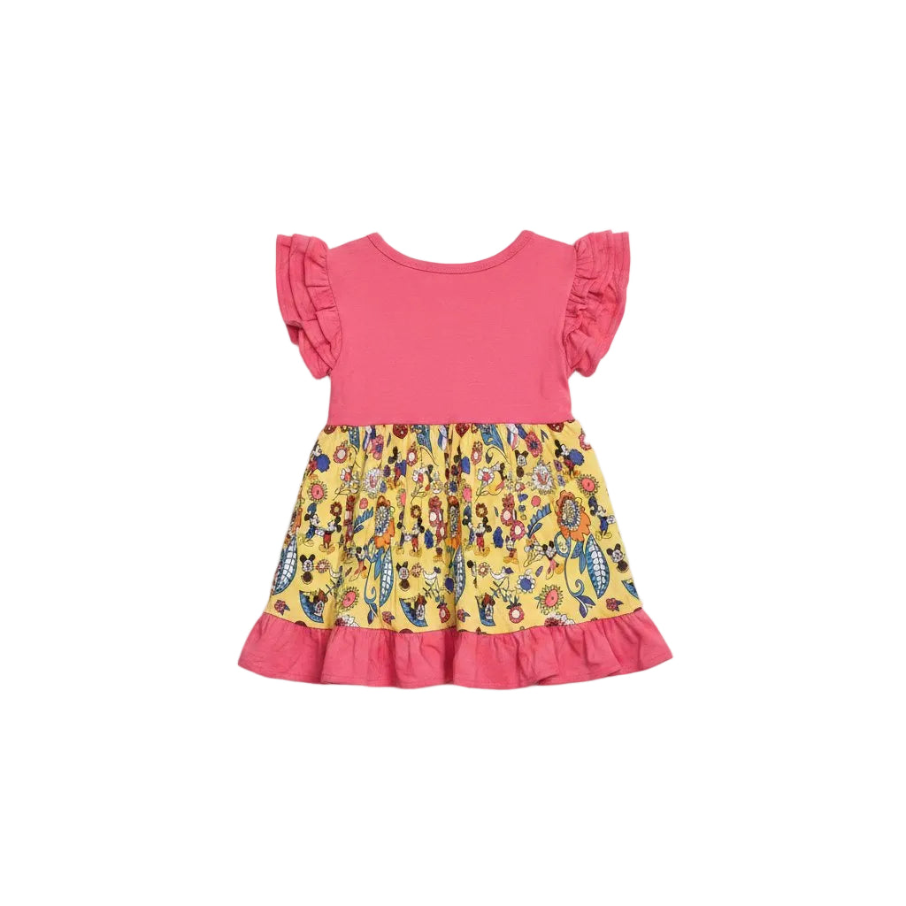 Pink and yellow dress with floral pattern on a light gray background