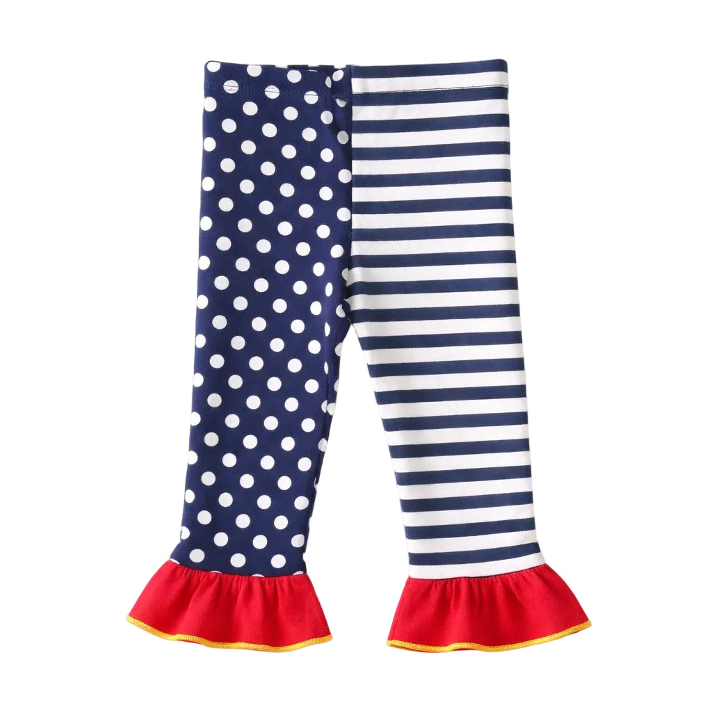 Navy blue and white polka dot and striped leggings with red ruffles on a white background